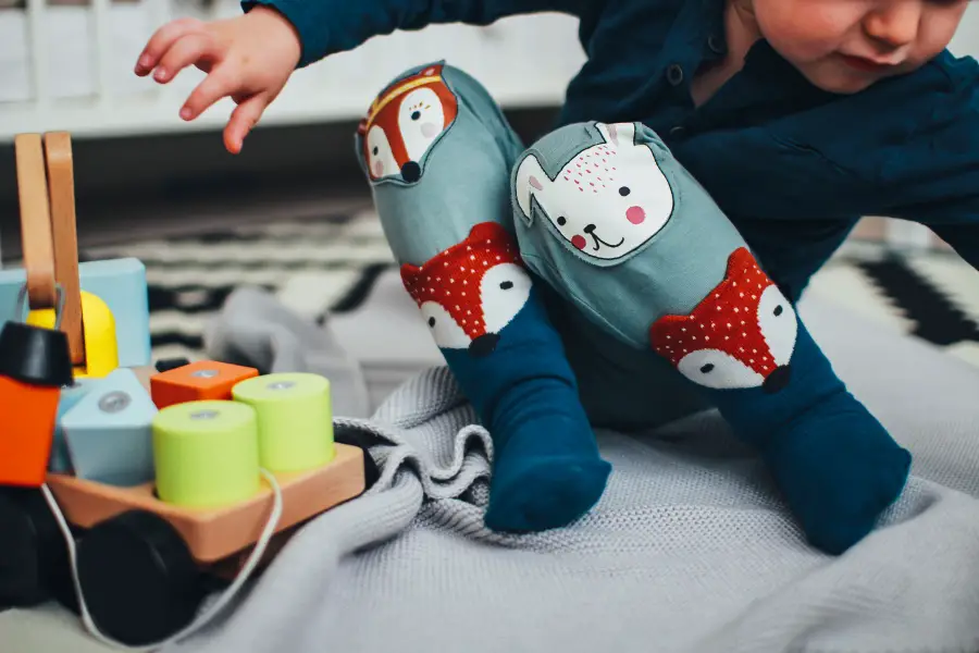 child playing with basic toys