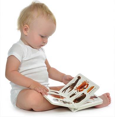 baby reading book and learning