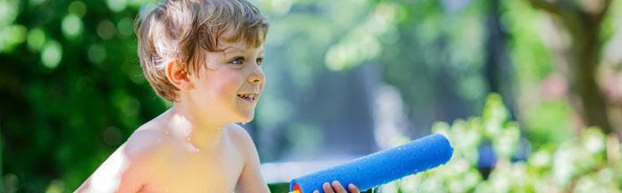 kid-playing-with-a-water-gun