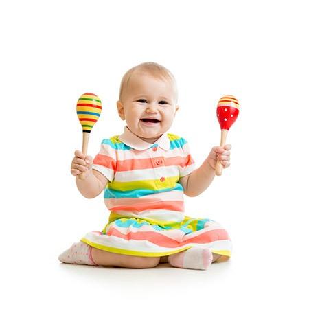 baby girl with rattles