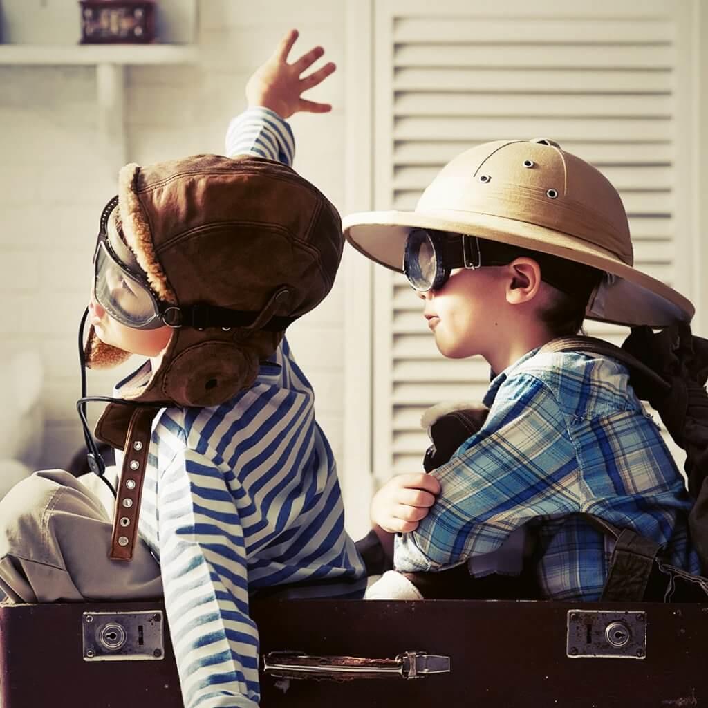 Kid-On-Suitcase-Traveling-With-Kids-Blog-Page