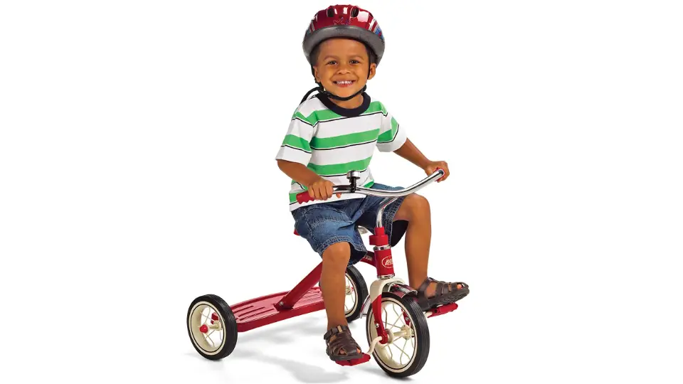 child riding tricycle