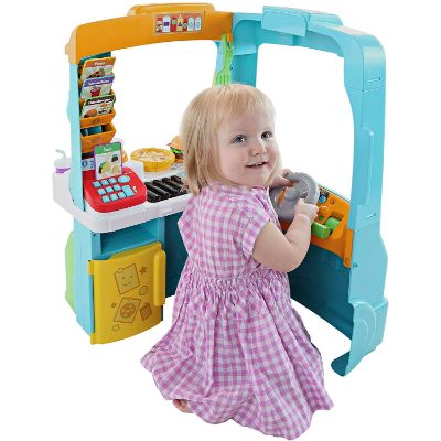 fisher-price servin’ up food truck play kitchen for kids and toddlers kid playing