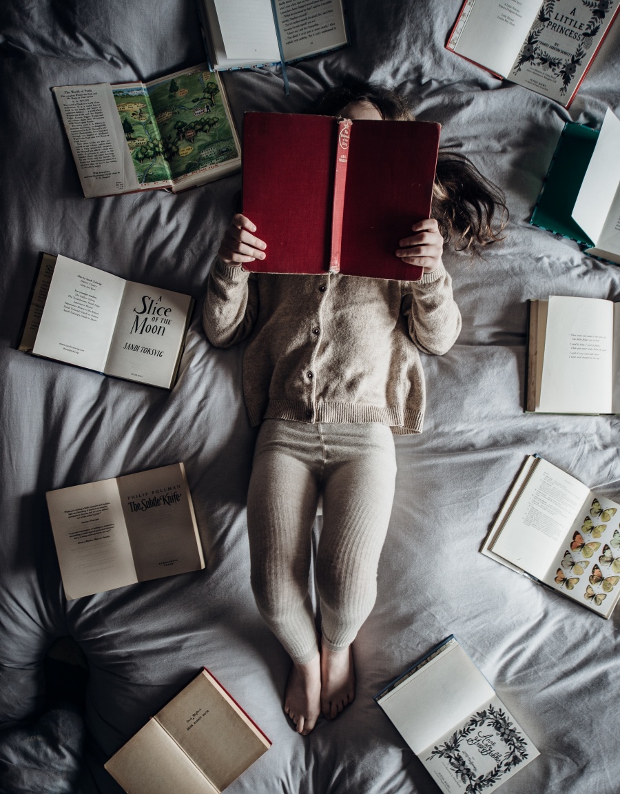 child reading in bed