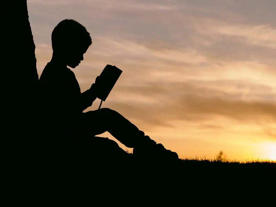 kid reading a book