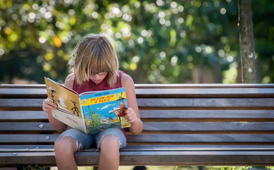 kid reading magazine