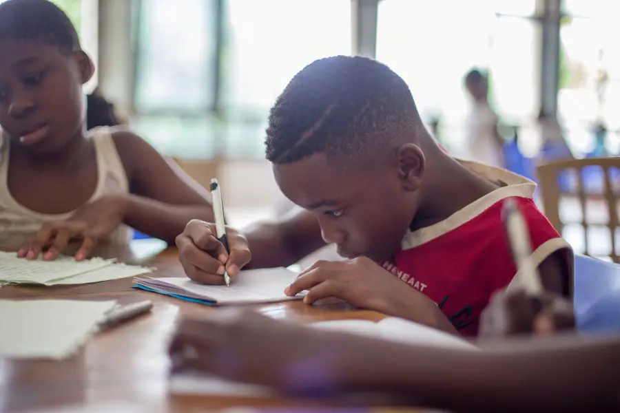 children in school doing homework