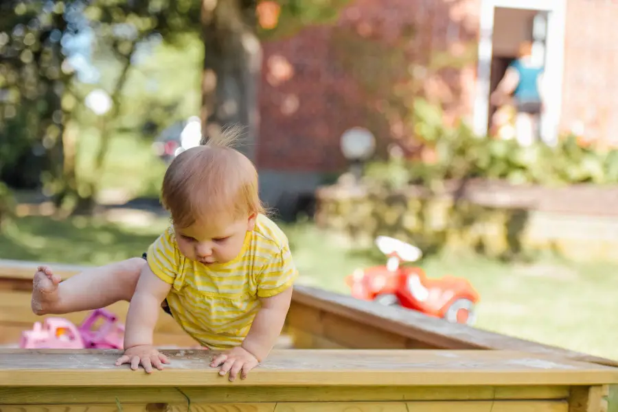 baby in a sandbox