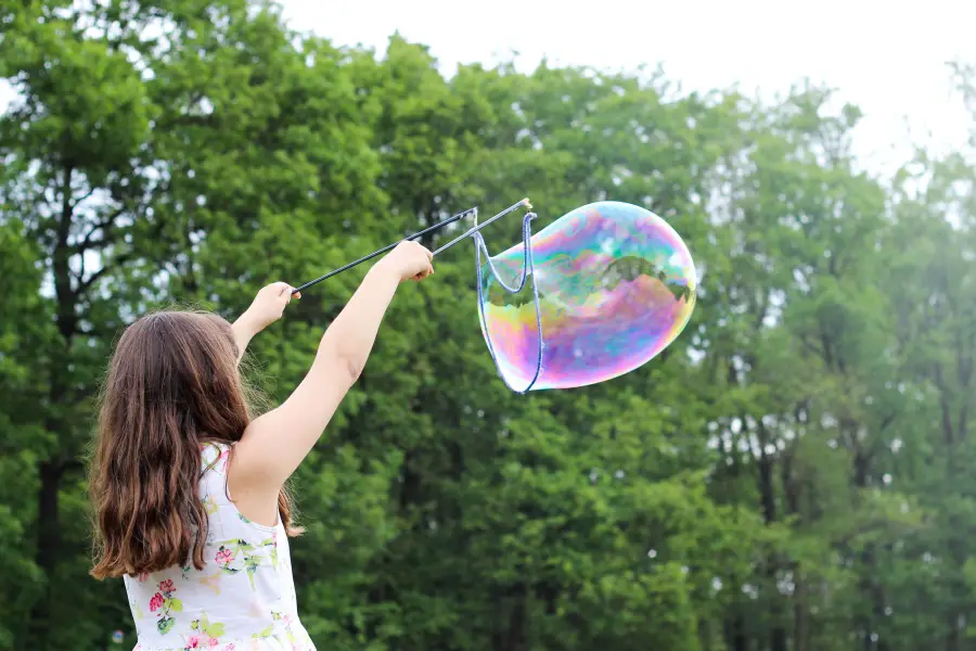 child making a baloon