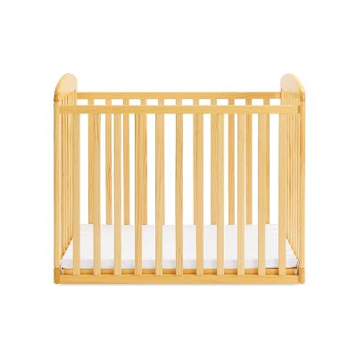 davinci alpha mini rocking natural portable cribs front