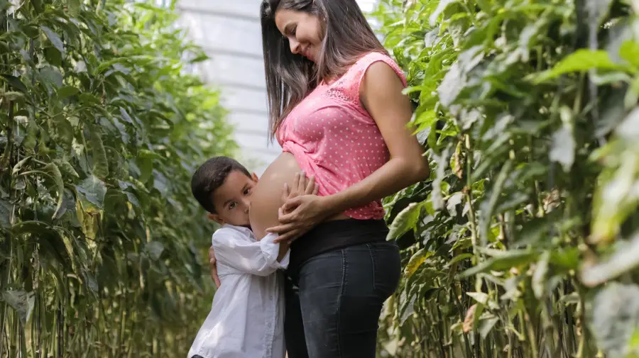pregnant woman and her child